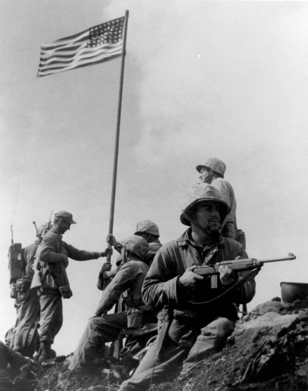 Soldiers raising flag