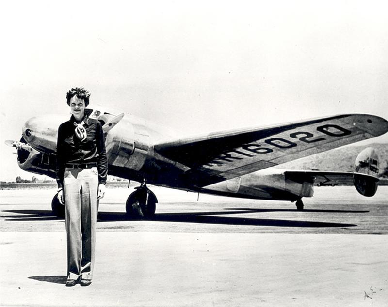 amelia-earhart-standing-in-front-of-the-lockheed-electra-in-which-she-disappeared-in-july-1937