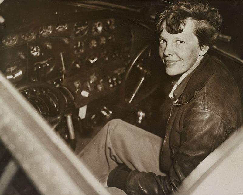 amelia-earhart-sitting-in-the-cockpit-of-an-electra-airplane