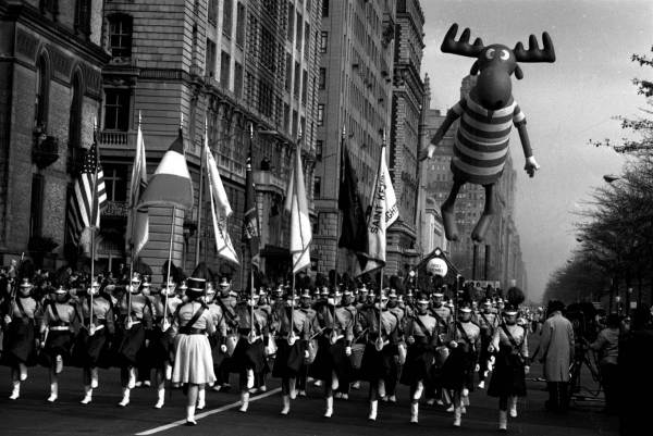 Color guard with U.S. flag and Bullwinkle the Moose balloon in background, at Macy's Thanksgiving Day Parade, unknown year.